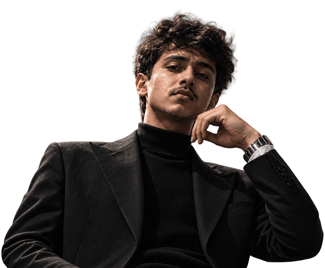 Balram Maurya seated in a dark suit